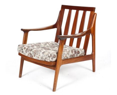 A 1960's vintage Danish influenced teak wood lounge chair/armchair, with propeller armrest angled tapering legs supporting a 