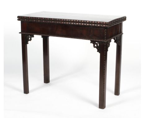 A mahogany card table, 19th century, in the Chippendale style, with pierced brackets, 74cm high x 86cm wide x 43cm deep when 