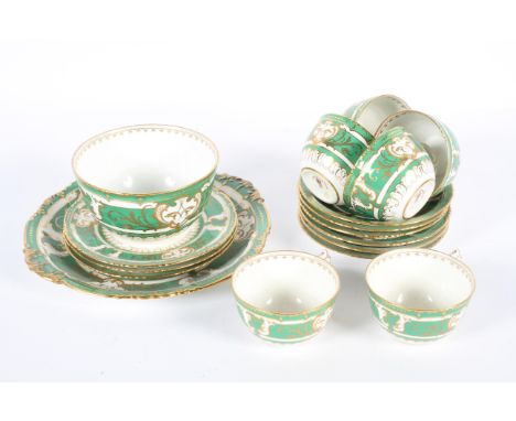 A Royal Crown Derby part service, date cypher for 1921, with scrolling gilt decoration on a green and white ground, comprisin