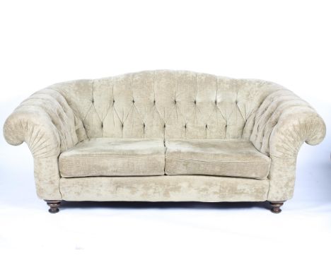 A contemporary chesterfield two-seater sofa  by 'John Sankey', upholstered in beige chenille, on turned Victorian-style feet,