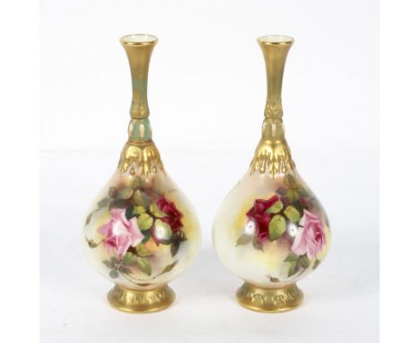 A pair of Royal Worcester blush ivory drop shaped vases, decorated with rose blooms, signed by J Flexman, 21 cm high.