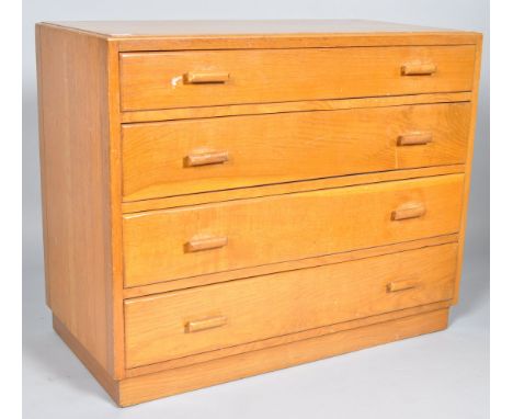 A 1940's retro vintage golden oak utility furniture chest of drawers comprising of a straight set of four drawers with pull h