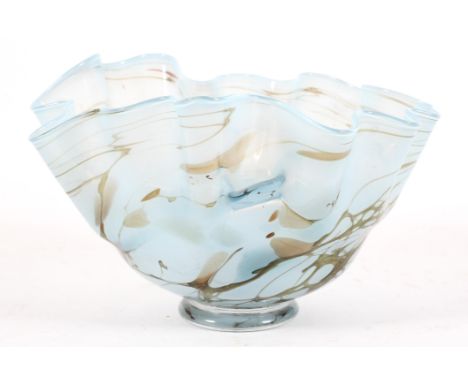 A Studio glass bowl. 20th century, etched indistinct signature, of handkerchief form, in light blue opaque glass, marbled in 