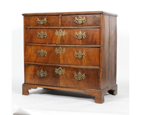 An early 18th century walnut chest of drawers, comprising two short drawers above three graduated long drawers, within moulde