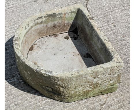 A horseshoe shaped trough, with aperture, 71.5 cm wide
