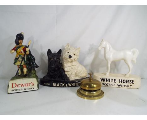 Breweriana - four Scotch Whisky advertising models to include Black & White, Dewars, White Horse and Bells, largest approxima