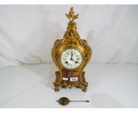 Antique late 19th century French balloon form mantel clock, shaped wooden case with applied rococo gilded castings and floral