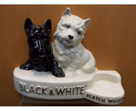 A Black & White Scotch Whisky ceramic advertising display marked Sylvac, 25 cm to tip of West Highland terrier's ear. Estimat