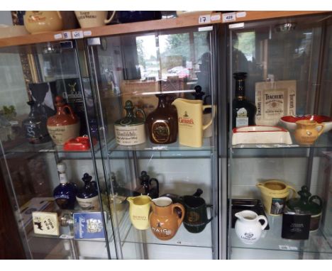 Breweriana - a good mixed lot of whisky related collectables to include empty whisky tins, empty ceramic decanters, ceramic a