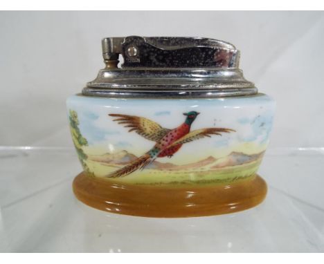 Minton - A Minton ceramic cased Ronson table lighter depicting a pheasant in flight, signed A Holland. Est £35 - £50