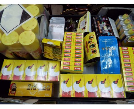 A good mixed lot of smoking related items to include lighter fluid, butane gas refills, filter tips, rolling papers, lighters