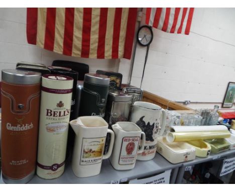 Breweriana - a quantity of whisky related collectables to include empty whisky tins, ceramic ashtrays and water jugs to inclu