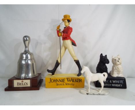 Breweriana - four Scotch Whisky advertising models to include Johnnie Walker, a ceramic Black & White Scotch Whisky, White Ho