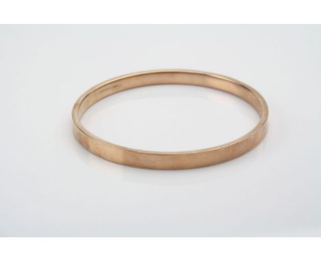 9ct rose gold slave bangle, plain polished form, width approximately 7mm