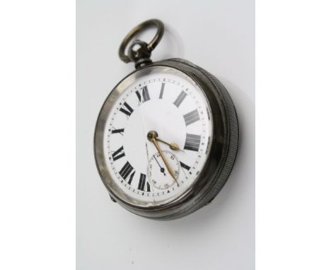 Early 20th century silver open face key wind pocket watch, white enamel dial and subsidiary dial, black Roman numerals, poker