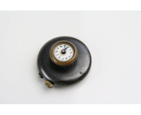 A vintage Swiss made Gents buttonhole watch with white enamel dial.