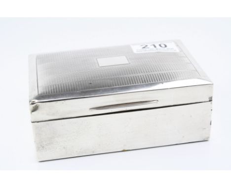 Silver cigarette box, engine turned design to hinged lid, blank rectangular cartouche, hallmarks rubbed, length approximately