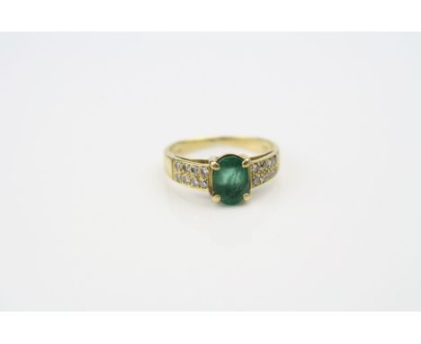 Emerald and diamond 18ct yellow gold ring, oval mixed cut emerald to centre measuring approximately 7mm x 5mm, four claw sett