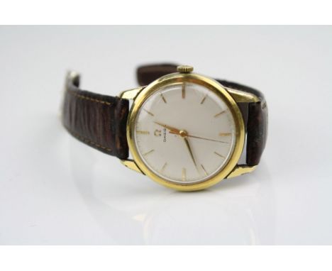 A Vintage Gold Plated Omega Automatic Gents Wrist Watch with Champagne Face and gold Baton Markers, omega logo to the winding