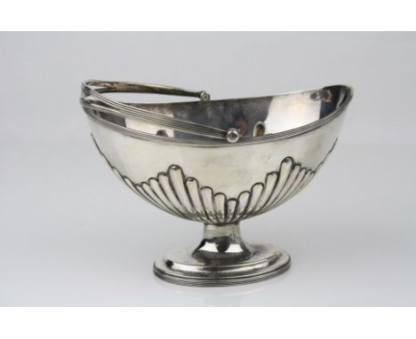 Victorian silver swing handled pedestal sugar bowl, the oval bowl with gadrooning to lower half, reeded and pierced swing han