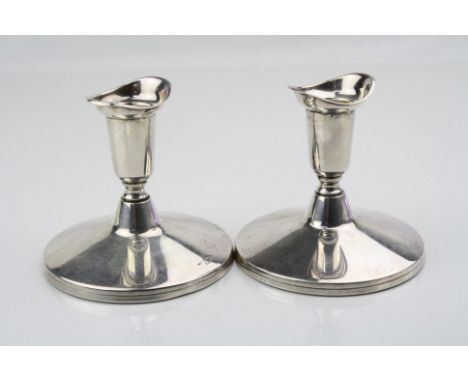 Pair of Swedish silver dwarf candlesticks, inverted bell shaped sconce to short tapered stem, large moulded plain polished fi