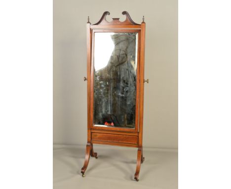 AN EDWARDIAN MAHOGANY AND INLAID CHEVAL MIRROR, the broken swan neck pediment flanked by urn shaped finials, rectangular beve