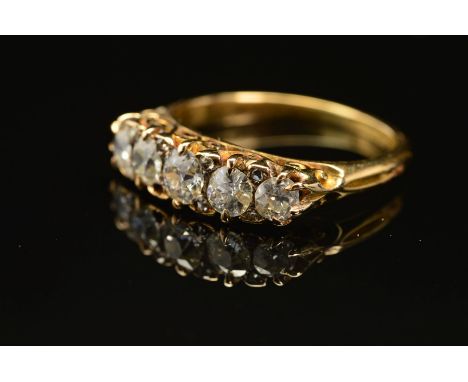 A VICTORIAN DIAMOND HALF HOOP RING, five old European cut diamonds, graduating in size from 3.5mm to 4.5mm in diameter, inter