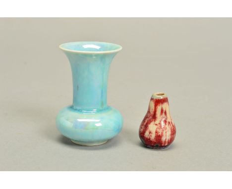 A RUSKIN POTTERY HIGH FIRED MINIATURE VASE BY WILLIAM HOWSON TAYLOR, ovoid with tapering neck, covered in a red and white mot