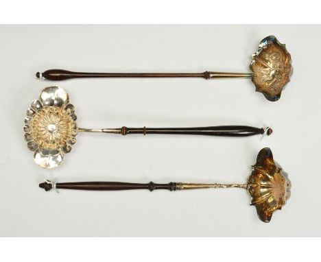 A GEORGE III SILVER PUNCH LADLE, of double lipped wavy oval form, engraved 'H' to underside of bowl, on a turned wooden handl