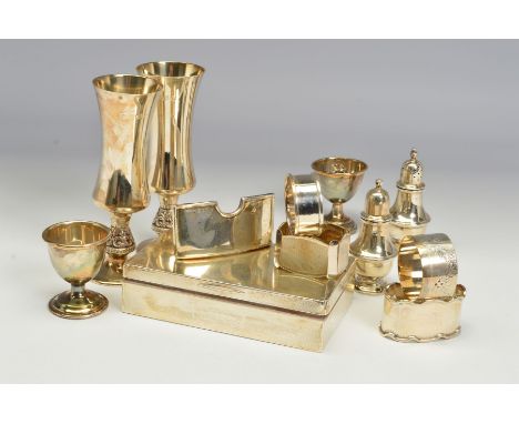 A GROUP OF MOSTLY 20TH CENTURY SILVER, comprising a pair of Elizabeth II champagne flutes of waisted form, on foliate cast st