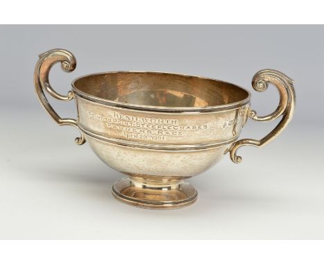 AN EDWARDIAN SILVER TWIN HANDLED TROPHY, of circular form, engraved 'KENILWORTH POINT TO POINT STEEPLECHASES FARMERS RACE APR