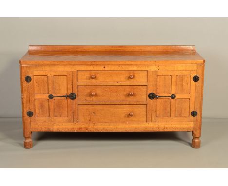 ROBERT THOMPSON OF KILBURN MOUSEMAN OAK 5FT SIDEBOARD, with a raised back, adzed top, the sides with four panels, the front w