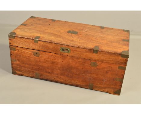 A 19TH CENTURY CAMPHORWOOD AND BRASS MOUNTED TRUNK, the rectangular top with flush fitting handle to the front edge, the base