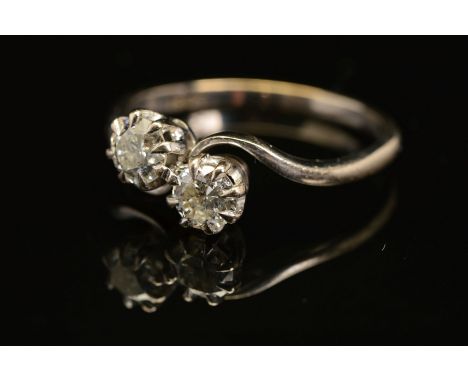 A MID 20TH CENTURY TWO STONE DIAMOND CROSS OVER RING, two brilliant cut diamonds each measuring approximately 4.9mm in diamet