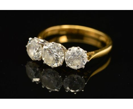 A MODERN 18CT GOLD THREE STONE DIAMOND RING, estimated modern round brilliant cut total diamond weight 2.65ct, colour assesse