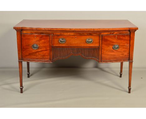 AN EARLY 19TH CENTURY MAHOGANY AND INLAID BOW FRONT SIDEBOARD, fitted with a single drawer above a reeded wavy apron, flanked