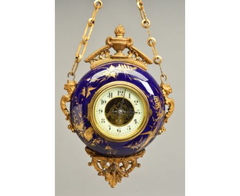 A LATE 19TH CENTURY GILT METAL AND PORCELAIN CASED CIRCULAR WALL HANGING CLOCK, the blue ground with raised gilding of flower