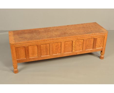 ROBERT THOMPSON OF KILBURN MOUSEMAN OAK RECTANGULAR BLANKET CHEST, the hinged adzed top above an eight panel front, on short 