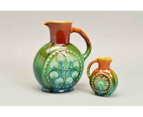 CHRISTOPHER DRESSER FOR LINTHORPE POTTERY, a jug glazed in browns/greens, moulded with a circle and scroll design to both sid