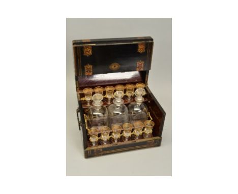 A 19TH CENTURY FRENCH EBONISED, TORTOISESHELL AND BRASS INLAID TABLE TOP LIQUEUR BOX, of domed form, hinged lid and hinged si