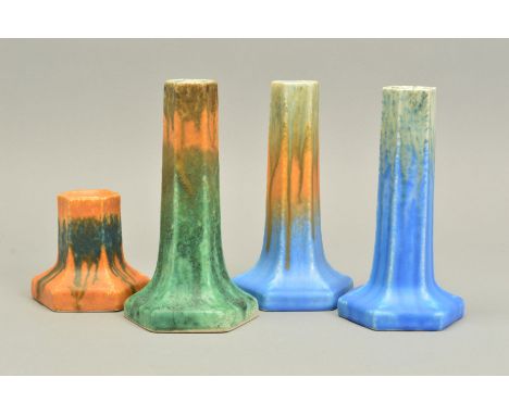 THREE RUSKIN HEXAGONAL CANDLESTICKS, an orange, green and blue example, a blue and green example dated 1931, height approxima