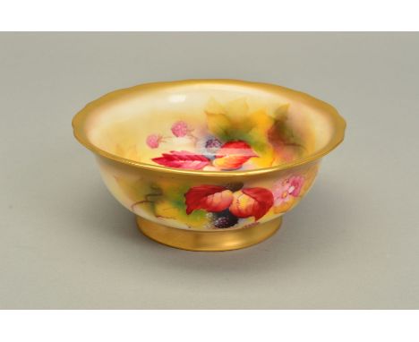 A ROYAL WORCESTER FOOTED BOWL WITH WAVY RIM, hand painted with autumnal fruits, signed by Kitty Blake, gilt rims, puce marks,