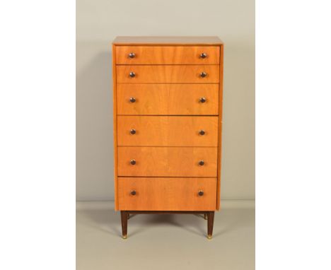A TALL G PLAN 1960'S TEAK CHEST OF SIX GRADUATING DRAWERS, with bakelite tulip handles, on four octagonal legs with brass cap