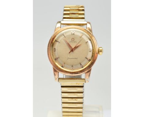 A GOLD PLATED OMEGA SEAMASTER AUTOMATIC WRISTWATCH, textured dial with gold coloured dauphine hands as well as Arabic numeral