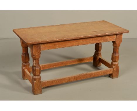 ROBERT THOMPSON OF KILBURN MOUSEMAN OAK RECTANGULAR COFFEE TABLE, the adzed top on four octagonal turned and block legs unite