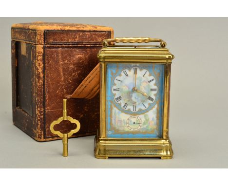 A LATE 19TH CENTURY GILT BRASS AND PORCELAIN CASED CARRIAGE CLOCK, with alarm and push button repeat mechanism, striking on a