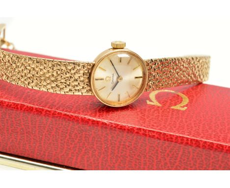 A LADIES OMEGA COCKTAIL MECHANICAL WRISTWATCH, silvered dial with yellow baton markers, hand wound movement, signed calibre 4