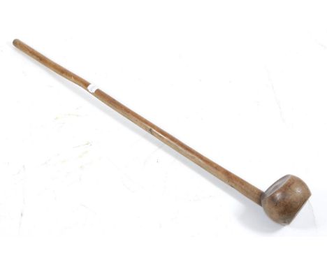 An Early 20th Century Zulu Knobkerrie, of light coloured hardwood, the slightly offset globular head with dished top and base