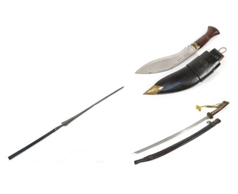 A Masai Lion Spear Blade, of elongated compressed diamond section, with split socket on a later short haft; a Chinese Sword, 