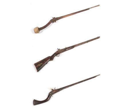 A 19th Century Afghan Flintlock Jezail, the 97cm steel barrel with flared muzzle, rounded lock plate, full wood stock with tw